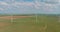 This is row of windmill renewable energy turbines on a wind farm in the country of Texas, USA