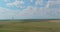 Row of windmill renewable energy turbines on a wind farm in the Texas