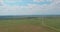 A row of windmill renewable energy turbines on a wind farm in the Texas state of the United States.