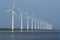 Row of windmills, mirrored in the Dutch sea