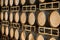 Row of wine barrels on stand