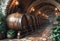 A row of wooden barrels in wine cellar.