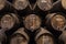 Row of wooden porto wine barrels in wine cellar Porto