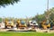 Row of working dump trucks parked in a row at construction zone site