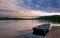 Rowboat Docked in a Lake at Sunset