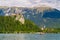 Rowboat on Lake Bled with Castle and Mountains.