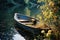 a rowboat sits on the bank of a river