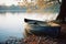 a rowboat sits on the shore of a lake