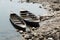 Rowboats Anchored Along the River