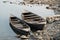 Rowboats Anchored Along the River