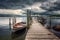 rowboats on a dock under dramatic stormy skies