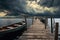 rowboats on a dock under dramatic stormy skies