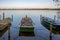 rowboats lie at a lake in the north of Germany in the morning in autumn