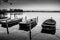 rowboats lie at a lake in the north of Germany in the morning in autumn