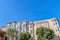 Rowhouses with bay windows and apartment building with sash windows in San Francisco, CA