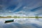 Rowing boat floating on a small lake in The Ooijpolder by Nijmegen, Holland.