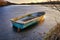 Rowing boat on a frozen lake in the sunshine