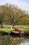 Rowing boat on river bank