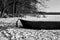 Rowing boat in the snow on a frozen lake