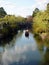 Rowing a boat of tourists along canal area of Kurashiki, Japan.