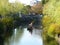 Rowing a boat of tourists along canal area of Kurashiki, Japan.