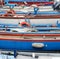 Rowing boats and motor boats moored at the pier