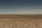 Rowing boats in the reeds. Wooden boat on the grassy shore of the Aral sea on a summer day