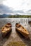 Rowing boats on shore of Derwent Water, Keswick.