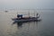 Rowing boats at twilight on Calatagan`s coast in the Philippines