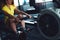 Rowing in the gym. Young woman training using rowing machine