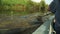 Rowing a paddle in the calm water of the river.