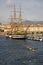 Rowing team in front of Amerigo Vespucci tallship in Genoa Harbor, Italy, Europe