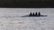 Rowing Team on Lake at Sunrise