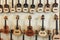 Rows of acoustic guitars on the wall