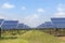 Rows array of polycrystalline silicon solar cells in solar power plant turn up skyward absorb the sunlight from the sun use light