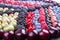 Rows of assorted fruits and berries: sweet cherry, bluberries, r