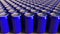 Rows of blue aluminum cans at factory. Soft drinks or beer production. Modern recycling packaging. 3D rendering