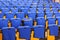 Rows of blue seats in lecture hall.