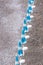 Rows of blue and white parasols and sunbeds on the beach at Atrani on the Amalfi Coast, Italy.