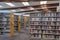 Rows of bookshelves with books and textbooks in the public library.