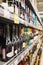 Rows of bottles of alcohol on the shelves in the supermarket. Vertical. Blurred