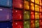 Rows of cargo shipping containers filmed by long focus camera. Multi-colored cargo shipment containers of different delivery cargo