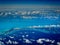 Rows of clouds dot an aerial view of Caribbean islands