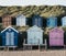 Rows of colorful beach huts in Milford on Sea, New Forest, UK