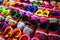 Rows of colorful hand made baby shoes in market