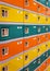 Rows of colorful safety boxes -  orange, yellow and green