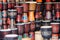 Rows of colorful wooden djembe drums at souvenir shop