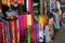 Rows of colourful silk scarfs hanging at a market stall in Indonesia