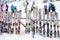 Rows of colourful skis on racks for rent