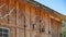 Rows of deer and elk horns on a wall of a barn